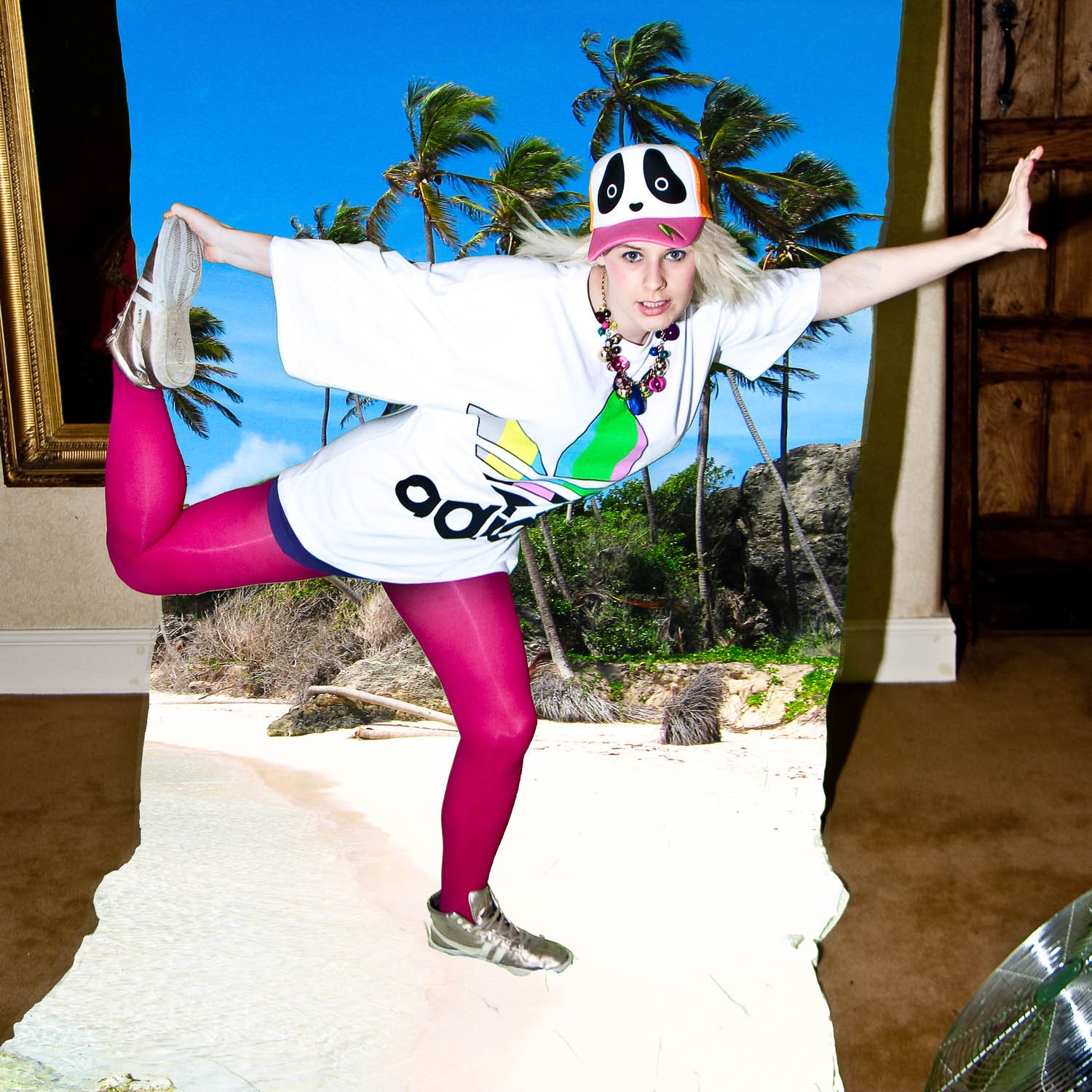 A model in white sunglasses, a sports top and pink leggings balancing with one leg raised.