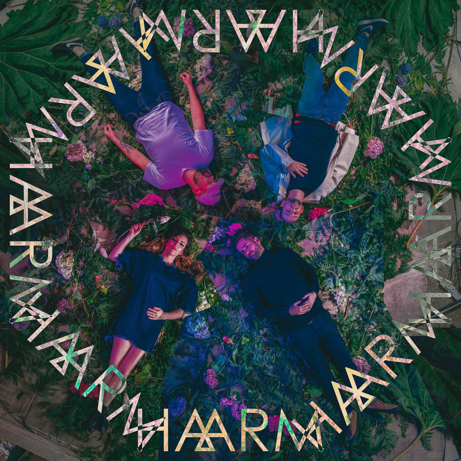 A dark floral collage framed by a circle of repeated HAARM lettering.