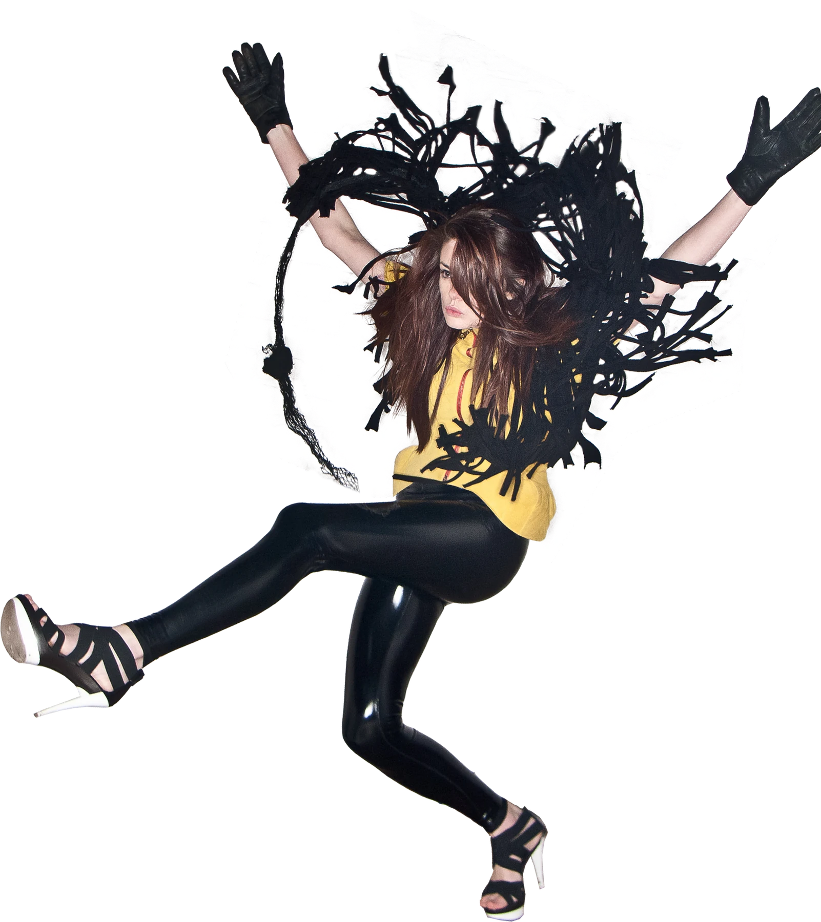 Dicey, suspended in a jump, wearing black fringe and yellow
