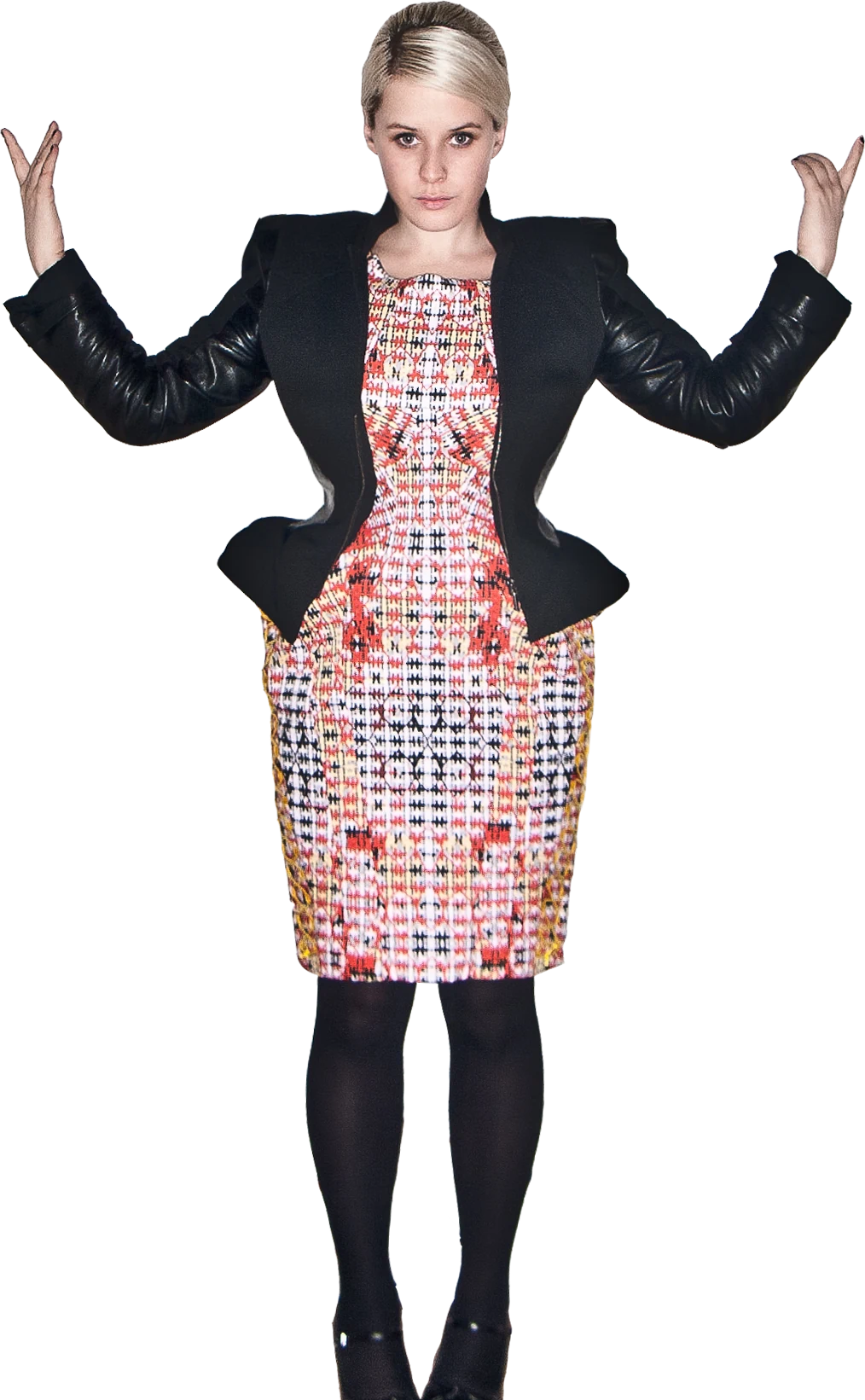 Lula, arms raised, in a patterned dress and black jacket