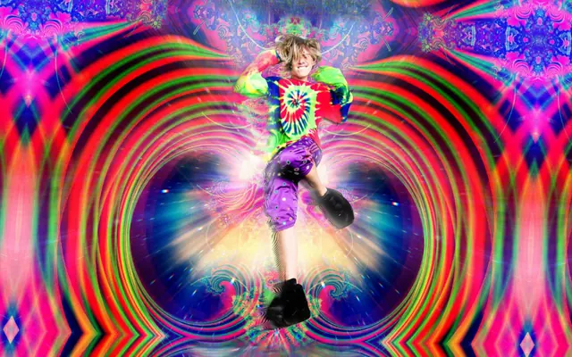 A jumping figure in a tie-dye top, purple patterned shorts and black boots against psychedelic rainbow rings.